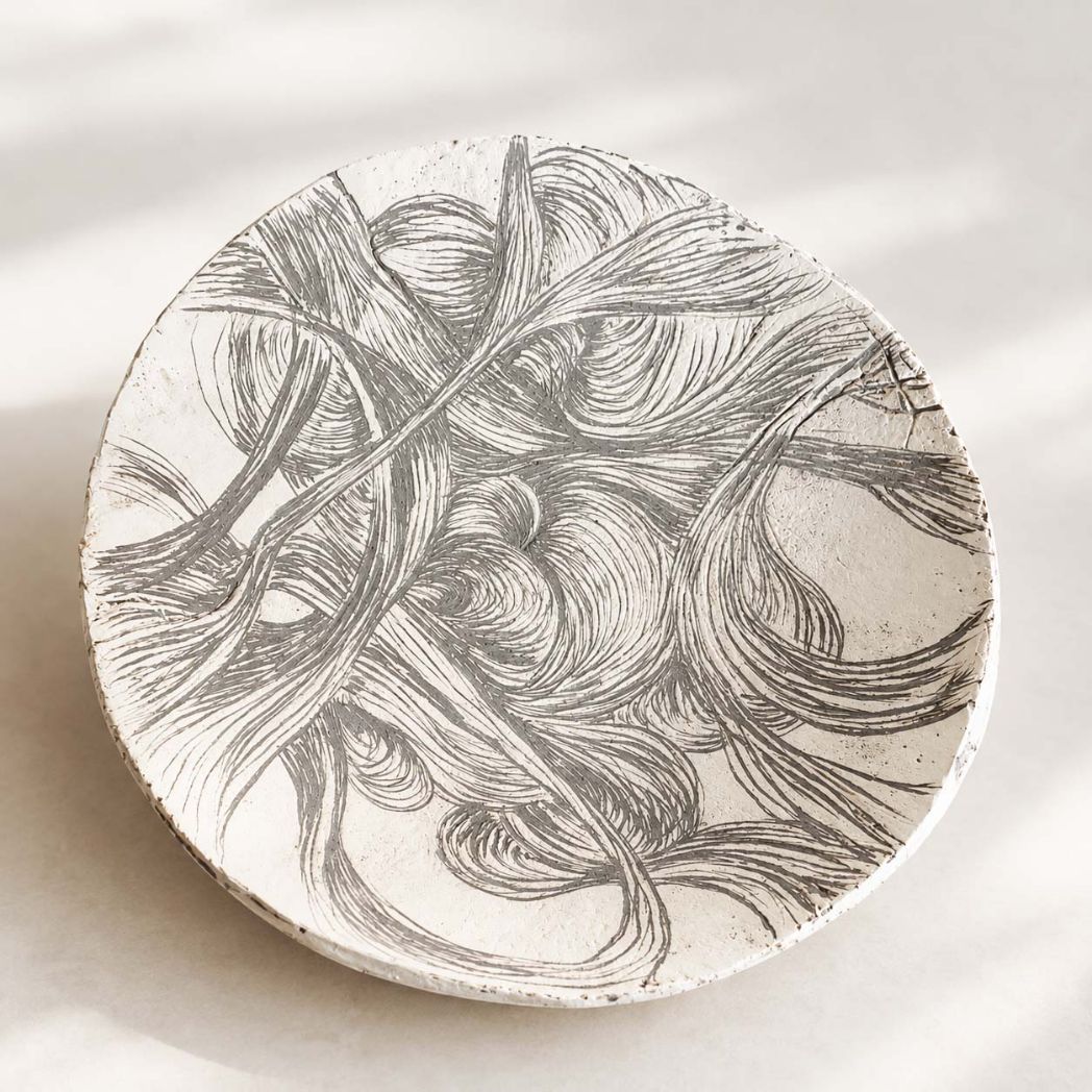 Dish with ornamentation. Handmade.